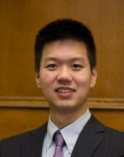 A photo of Yuan. He is a young Asian man and is smiling.